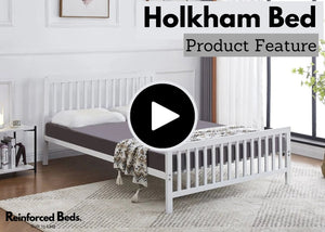 White metal frame with mattress and pillows